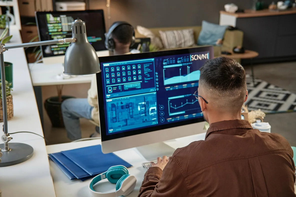 Engineer reviewing mission data dashboards